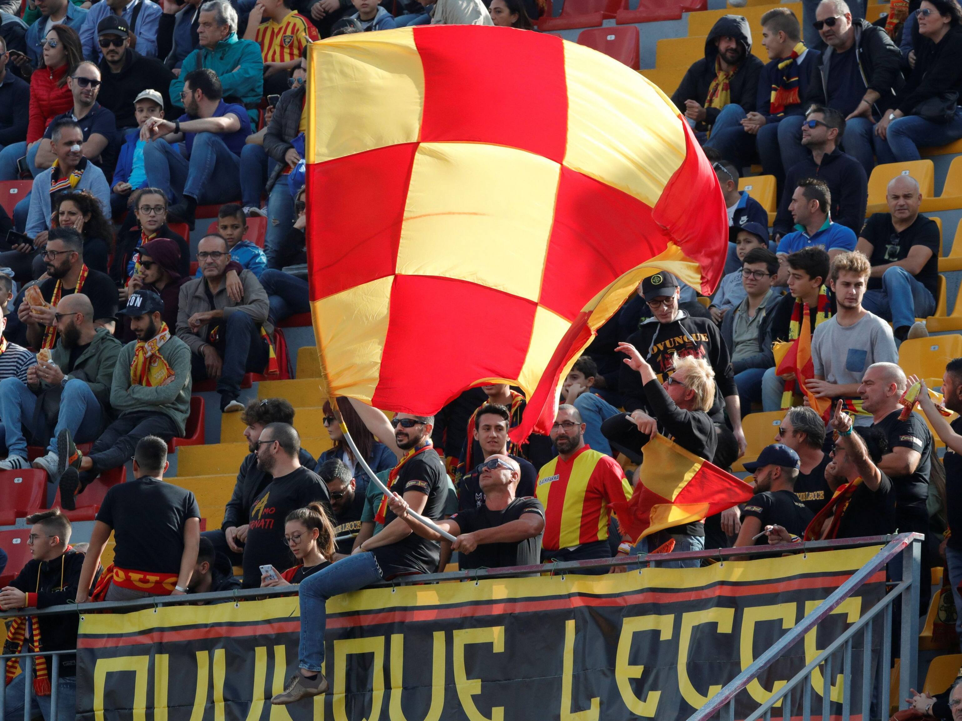 Soccer Football - Serie A - Lecce v Juventus - Stadio Via del Mare, Lecce, Italy - October 26, 2019 Lecce fans wave a flag inside the stadium before the match REUTERS/Ciro De Luca - Image ID: 2CM0852