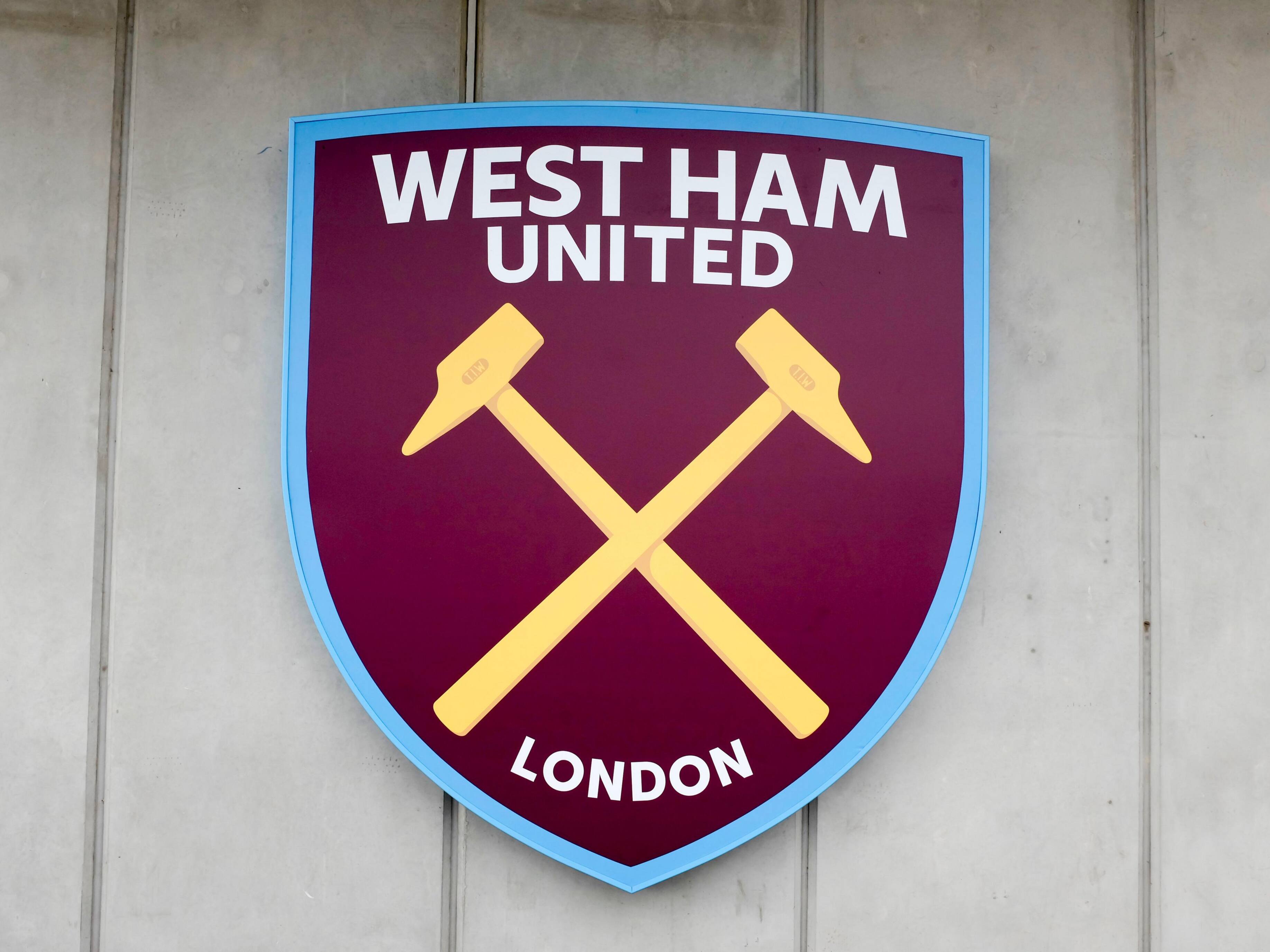 West Ham United logo on new Stadium Store beside the converted 2012 Olympic Stadium - Image ID: GM6R66