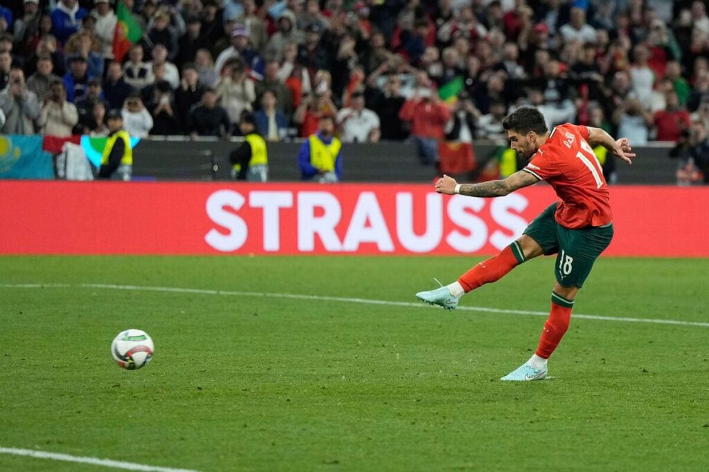 Ruben Neves scores a penalty for Portugal