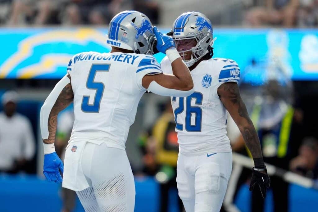 Jahmyr Gibbs and David Montgomery celebrate a touchdown for the Detroit Lions.