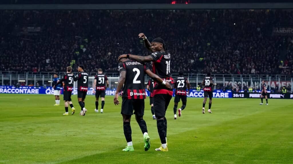 AC Milan players celebrate scoring against rivals Inter