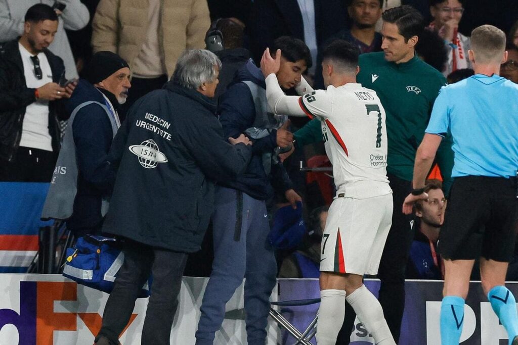Pedro Neto consoles a ballboy after the Chelsea forward pushed him during a game against PSG