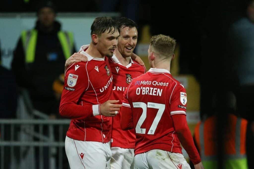 Wrexham players celebrate against Swansea