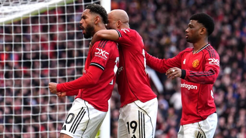 Manchester United players celebrate scoring against Aston Villa