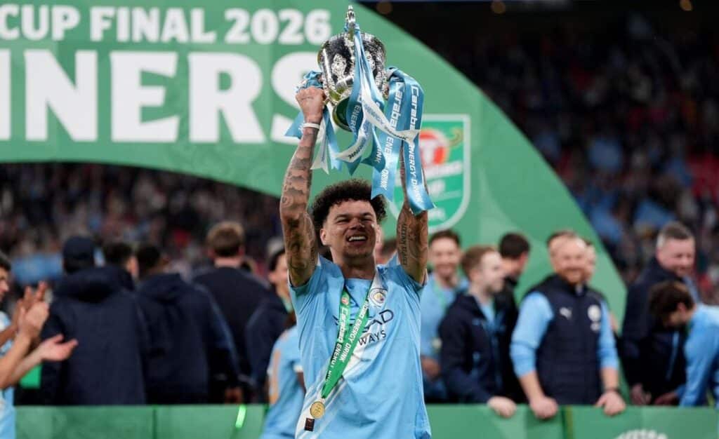 Nico O'Reilly of Manchester City lifts the EFL Cup.