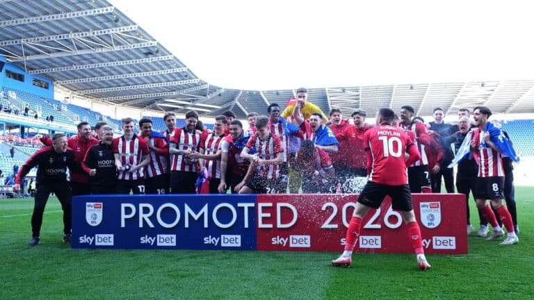 Lincoln City earn promotion to second tier for first time in 65 years
