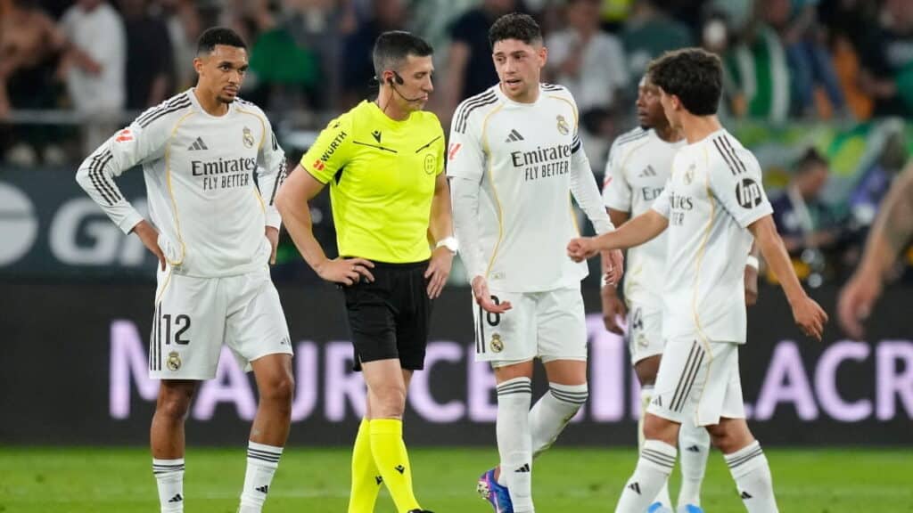 Real Madrid players confront referee after conceding a goal