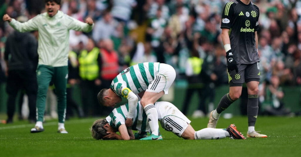 Celtic celebrate scoring against Hearts to win the Scottish title