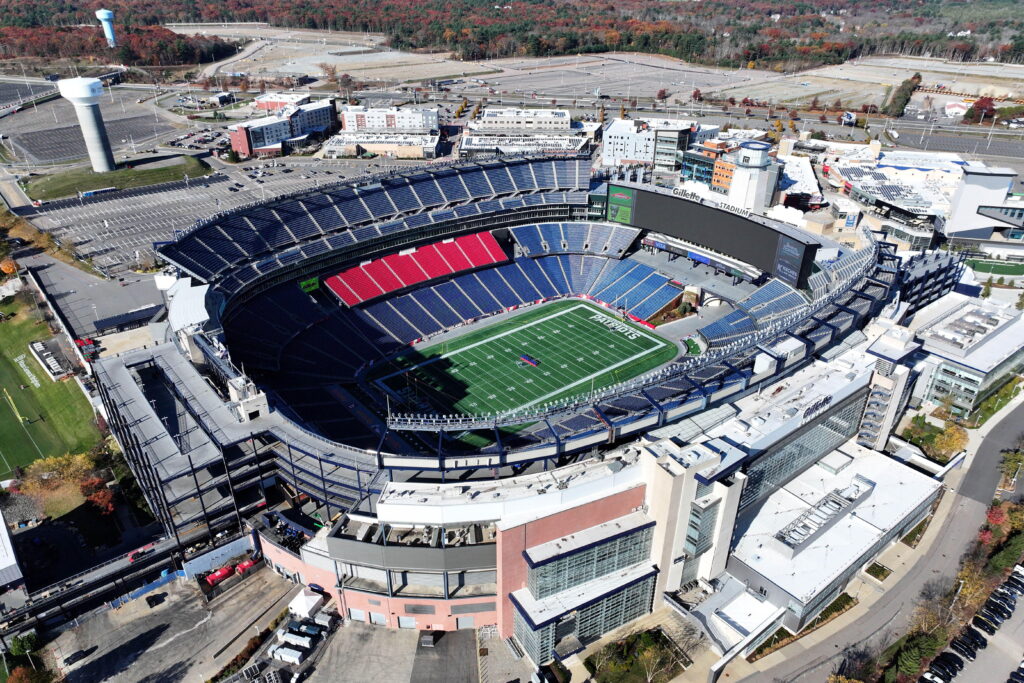 The Gillette Stadium home of NFL team the New England Patriots and MLS team the Revolution, which is also a World Cup 2026 venue, shown from above with blue seats and green grass in Boston, Foxborough, Massachusetts