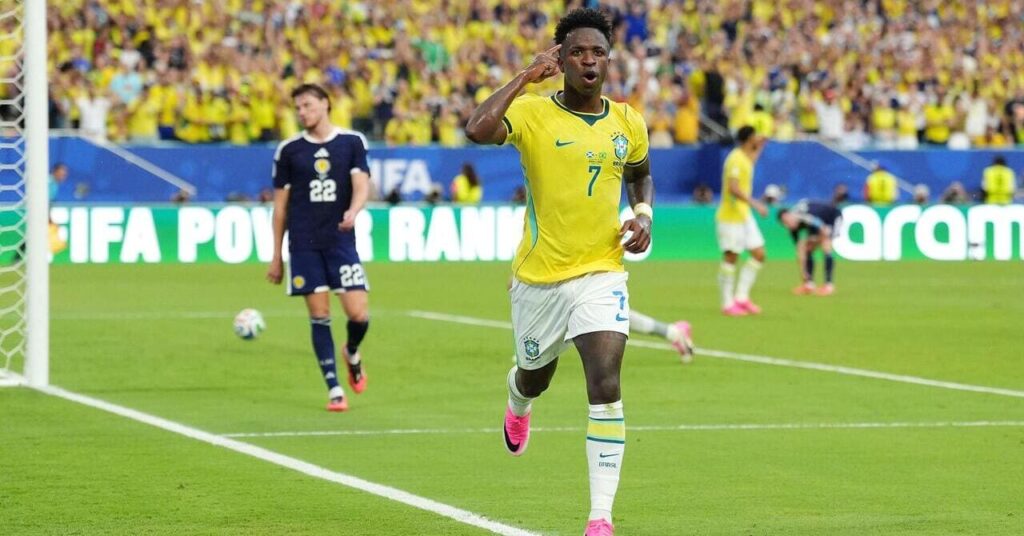 Brazil star Vinicius Júnior celebrates a goal against Scotland