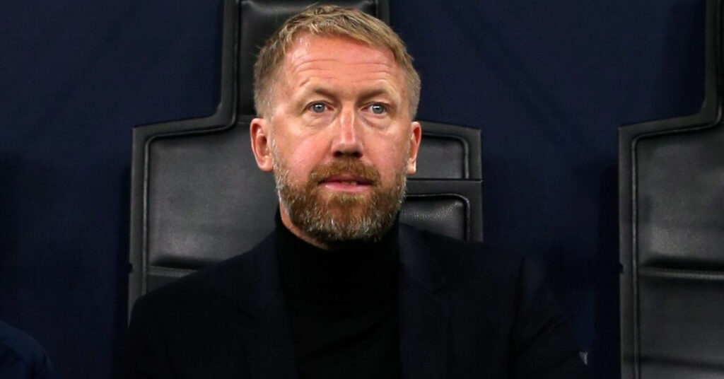 A photo of football manager Graham Potter looking sternly to his right. The Sweden head coach is sitting in a technical area containing dark seats in a stadium