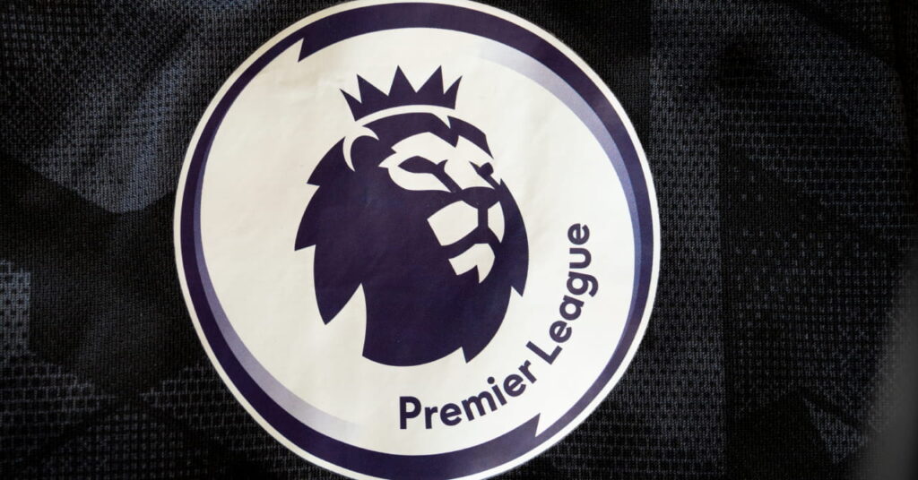 The Premier League football competition logo showing a graphic of a lion wearing a crown and looking to the left in dark print on a circular white background against a dark square