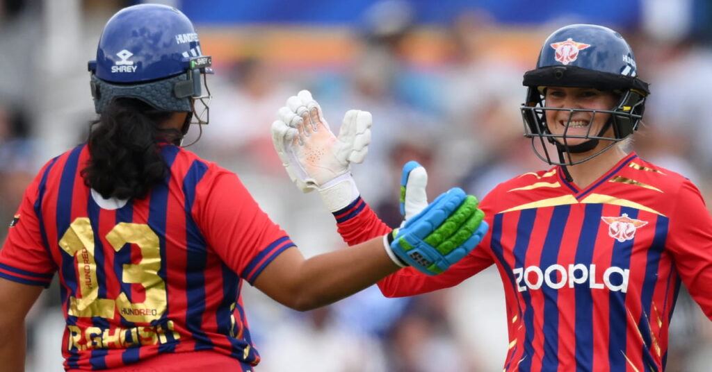 A photo of women's players in a red and blue kit congratulating each other in cricket competition The Hundred 2026