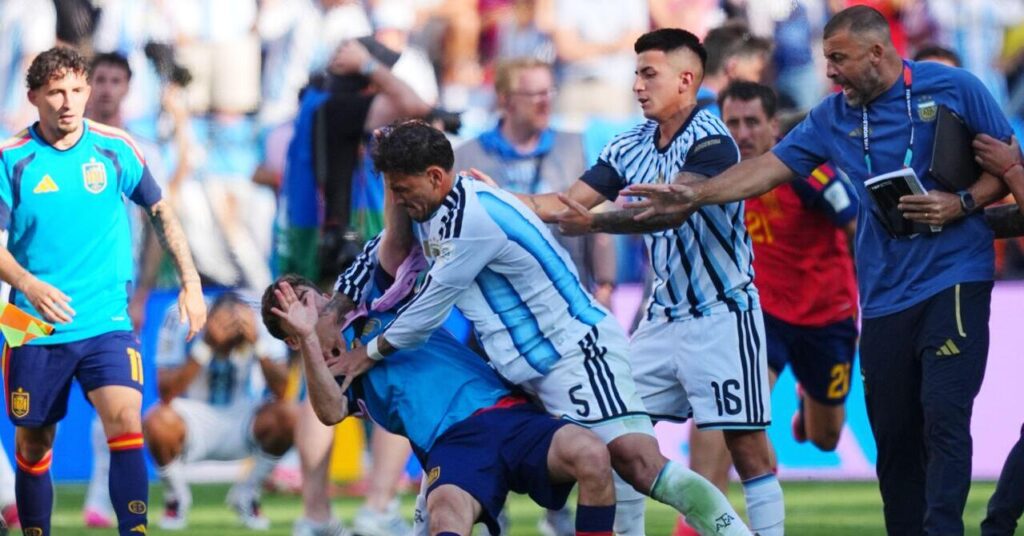 Argentina's Leandro Paredes knocks down Spain's Gavi during scuffle after the World Cup final soccer match between Spain and Argentina in East Rutherford, New Jersey