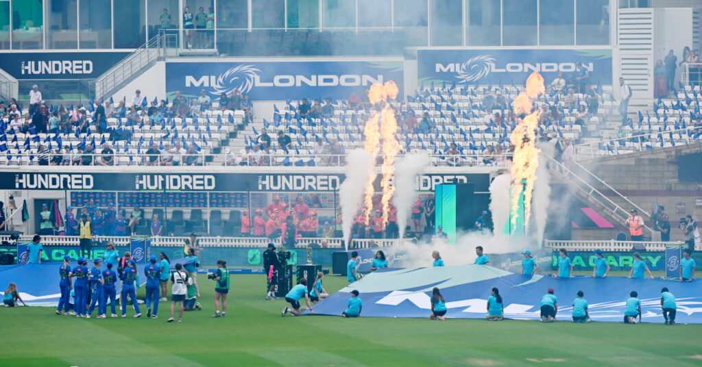 A photo of players emerging to fireworks in a stadium in cricket competition The Hundred 2026