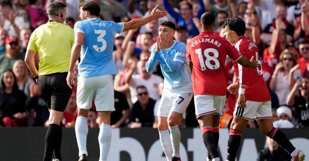 Manchester City midfielder Phil Foden reacts with disbelief after being sent-off against Manchester United