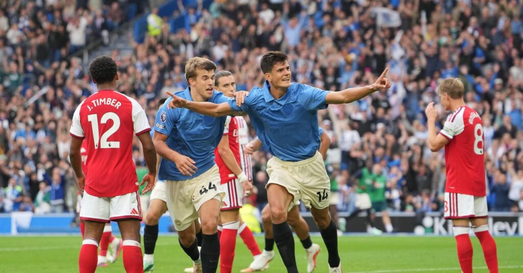 Brighton's Chema Andres, right and Luka Vuskovic celebrate after scoring