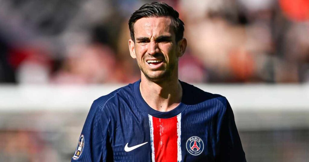 Spain footballer Fabian Ruiz on a pitch playing for Ligue 1 team Paris Saint Germain in the PSG home shirt of dark blue with a red and white line down the middle and the Nike tick in white and club badge depicting the Eiffel Tower on the chest